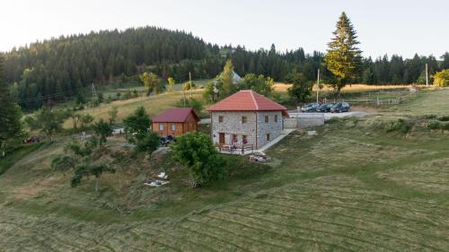 an aerial view of a house on a hill at Kula 1960 Stone House in Rožaje