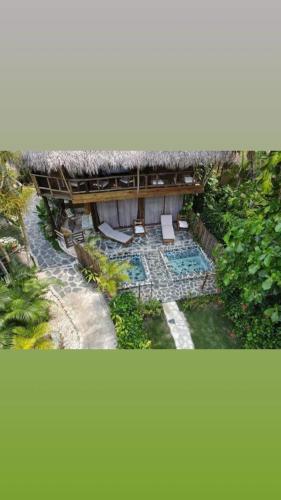 an overhead view of a house with a swimming pool at Cabarete Ecolodge Encuentro Surf Beach Kite in Perla Marina by BTCG Crypto in Bombita