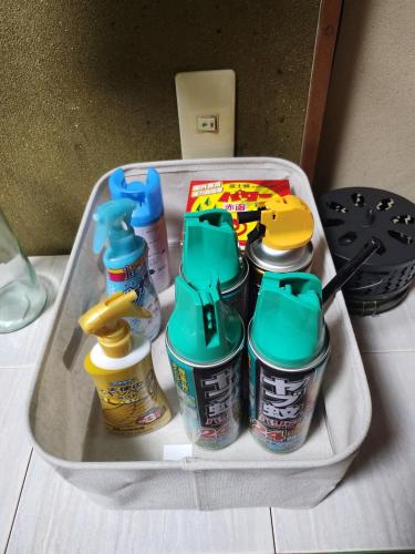 a suitcase with a bunch of drinks in it at いすみエンガワのある古民家 in Isumi