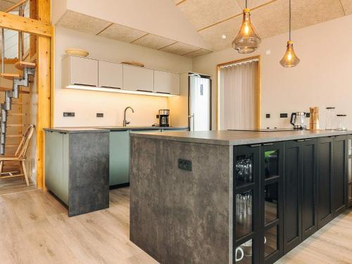 a kitchen with a large island in the middle at 5 star holiday home in Hadsund in Hadsund