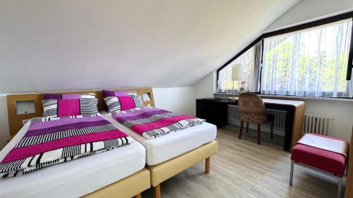 Postel nebo postele na pokoji v ubytování Haus Schanzenblick Fewo11 im Herzen des Schwarzwaldes