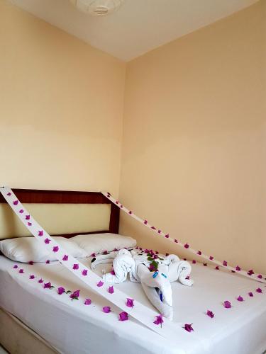 Ένα ή περισσότερα κρεβάτια σε δωμάτιο στο Palmen Apart Hotel