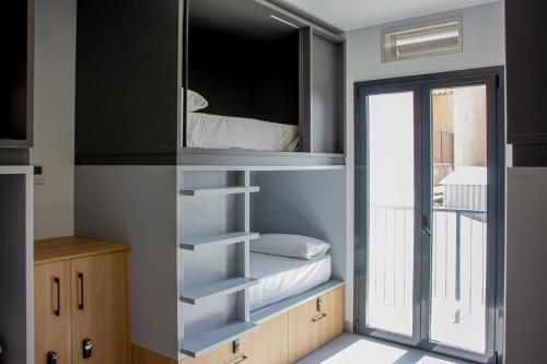 Letto o letti in una camera di Funker Hostel