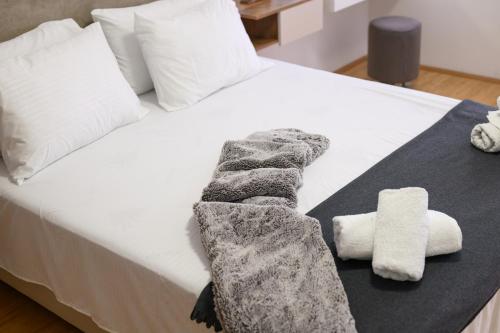 Postel nebo postele na pokoji v ubytování Emanuel Apartments
