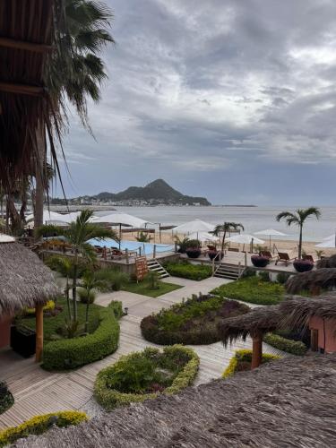 a resort with a view of the beach and the ocean at La Posada Hotel Boutique in Manzanillo
