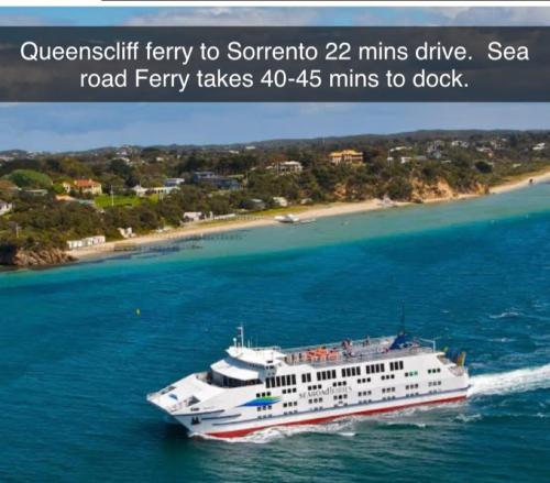a cruise ship on the water with a beach at Lake and Railway Guesthouse in Drysdale