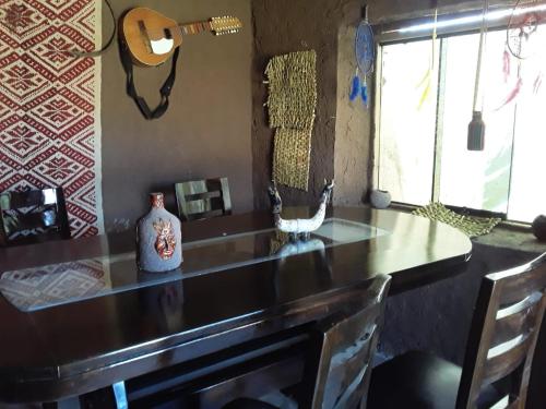 a kitchen with a wooden counter top with a sink at Casa Serena in Yanaoca