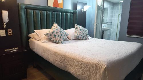 Ένα ή περισσότερα κρεβάτια σε δωμάτιο στο Hostal Mi Maravilla