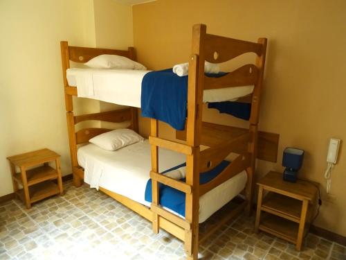 a room with two bunk beds in a room at Hospedaje La Videna in Lima