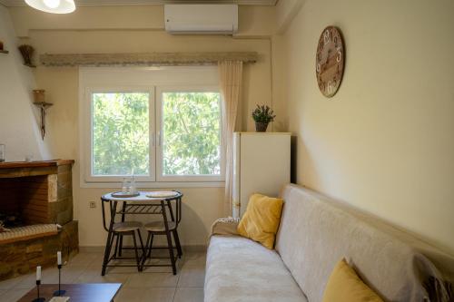 a living room with a couch and a table at Spacious Apartment in Mytilene in Mytilini