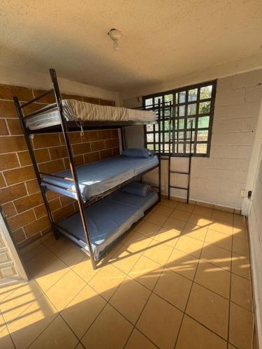 Ένα ή περισσότερα κρεβάτια σε δωμάτιο στο Jardín rubi