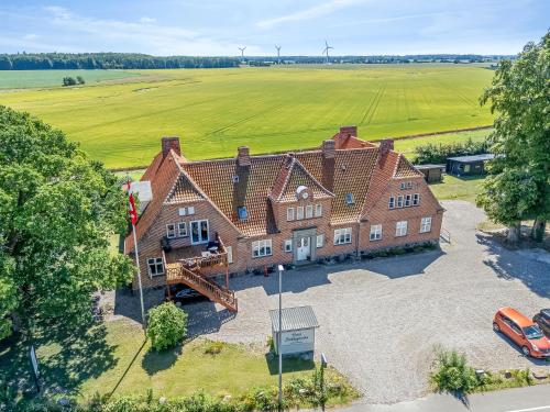 an aerial view of a large brick house at Stokkegaardens Hotel Apartments in Stokkemarke