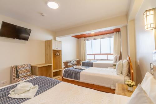 Postel nebo postele na pokoji v ubytování Cusco Hostal Qolla Wasi-II