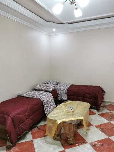 a living room with a couch and a table at Djawed hôt in Alger