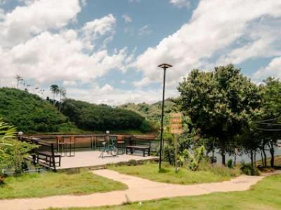 a park with benches and a street light and trees at Moon lake resort 