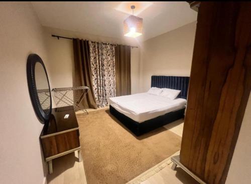 Ένα ή περισσότερα κρεβάτια σε δωμάτιο στο Azha Ain Sokhna Apartment private fully air-conditioned