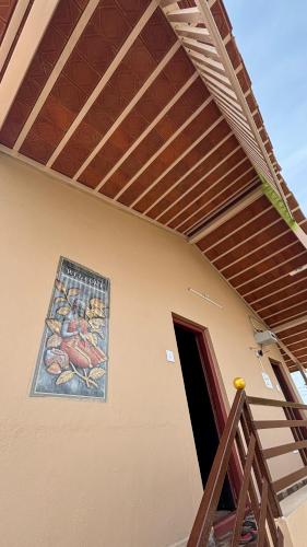 a building with a painting on the side of it at Prajwal home stay in Hampi