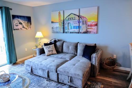 a living room with a couch and a table at Just Imagine! Newly Renovated Ocean View 1BR-1 Ba Condo in Ocean City