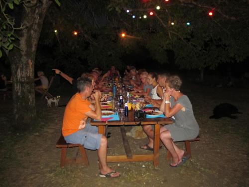 a group of people sitting at a long table at Goute la vie in Marchamp