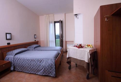 En eller flere senger på et rom på Hotel Ristorante La Bilancia