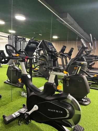 a bunch of exercise bikes in a gym at Apartahotel & Spa Jacetania in Jaca