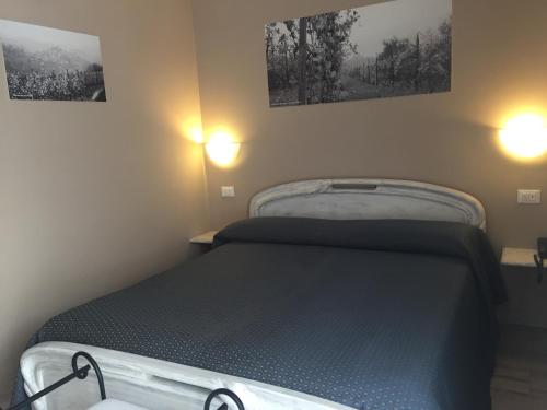 Postel nebo postele na pokoji v ubytování Hotel Ciocca