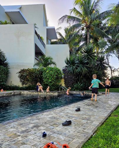 a group of people playing in a swimming pool at Play - Swim - Dive - Relax - Seaside Recharge in Cap Malheureux