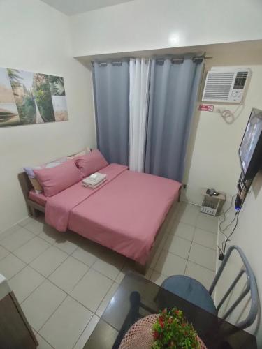 Llit o llits en una habitació de Gaby's Condotel