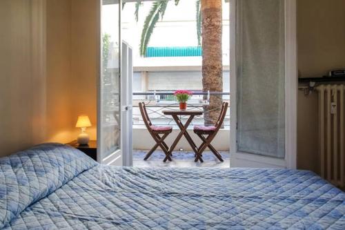 מיטה או מיטות בחדר ב-Appartamento in residence a 50 metri dal mare