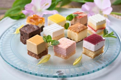a plate of different types of desserts on a table at Ooedo Onsen Monogatari Hotel Ranpu in Hirado