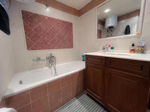 a bathroom with a tub and a sink at Cosy Stay Apartment with Panoramic View in Kalandra