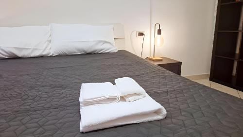 En eller flere senge i et værelse på Grazioso Appartamento a 500m da Piazza del Campo - ZTL Free