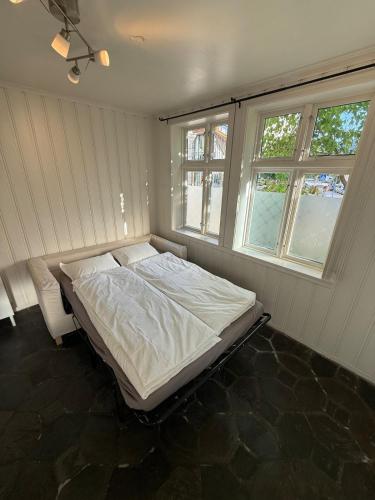 Ένα ή περισσότερα κρεβάτια σε δωμάτιο στο Central & Charming in Bergen