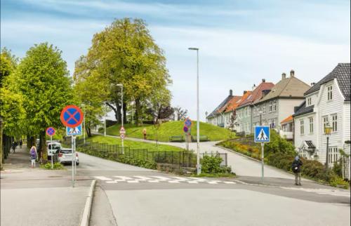a street with street signs on the side of the road at Central & Charming in Bergen in Bergen