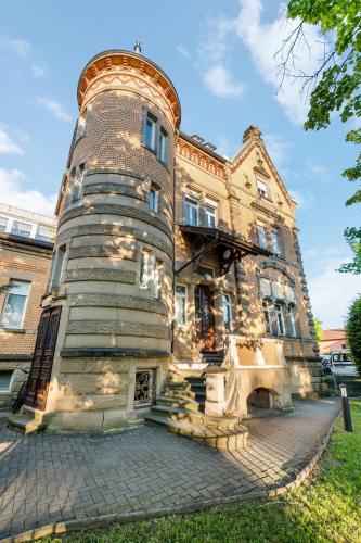 an old stone building with a round turret at LubuNest3 Terrasse mit Grill & eigenem Parkplatz in Ludwigsburg