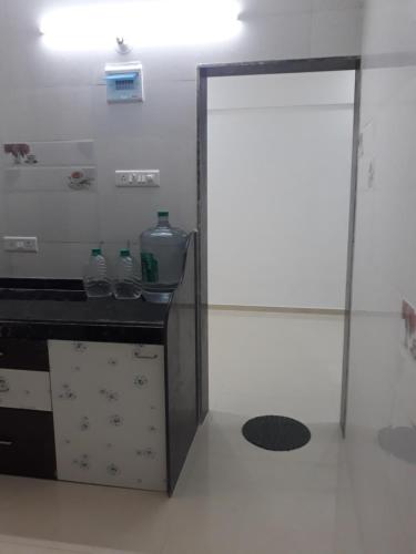 a room with a counter and a glass door at Spanish villa , chinchoti in Bapane