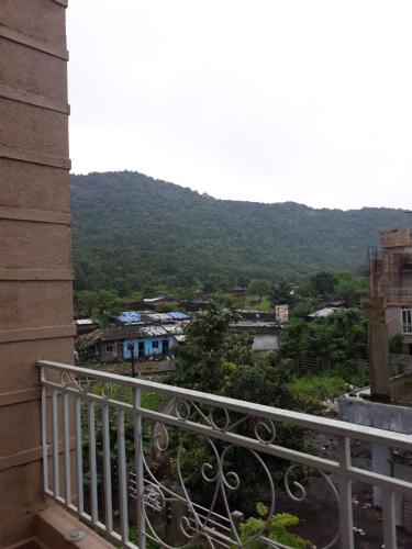 a view of a city from a balcony at Spanish villa , chinchoti in Bapane