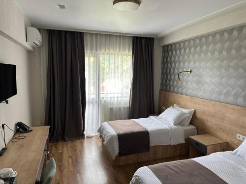 Postel nebo postele na pokoji v ubytování Astana Palace
