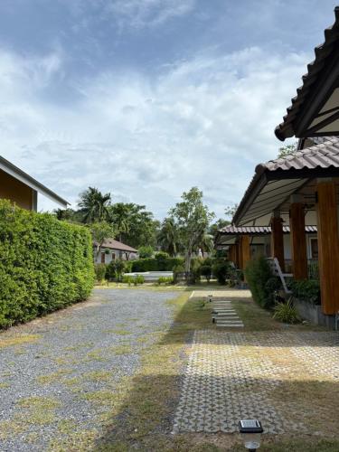 a cobblestone walkway next to a building at Villa Taa Koh Samui in Amphoe Koh Samui