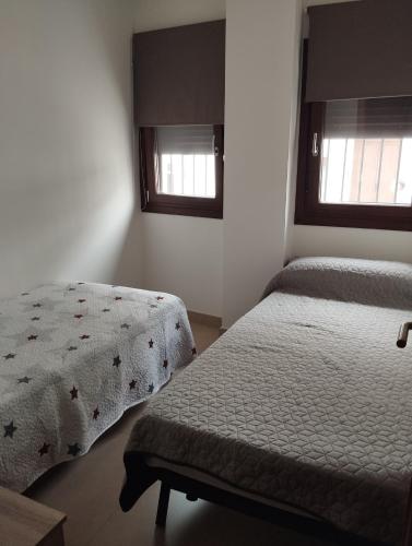 Postel nebo postele na pokoji v ubytování Apartamento céntrico con Parking