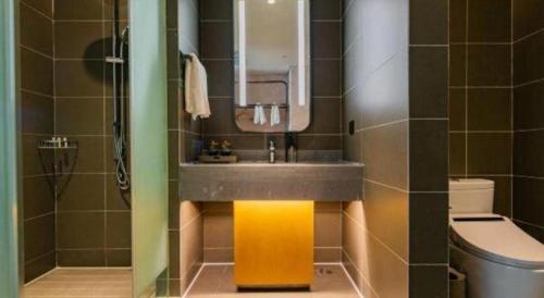 a bathroom with a sink and a toilet at ibis xian North Second Ring Weiyang Rd Hotel in Xi'an