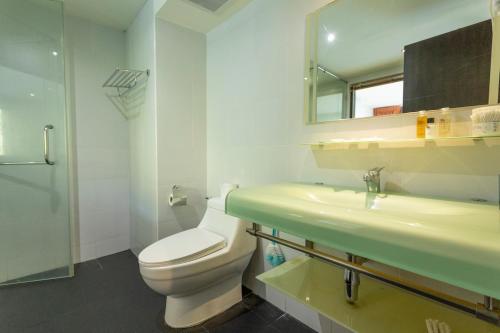 a bathroom with a toilet and a sink and a mirror at C134 Condo 1BR in Heart of Patong Pool, Beach, Bangla in Patong Beach