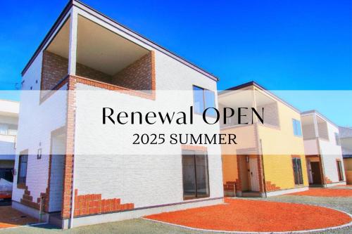 a building with a sign that reads renewal open summer at Villas Fuji ヴィラス富士 in Fujikawaguchiko
