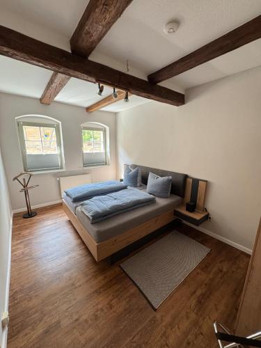 En eller flere senge i et værelse på Ferienwohnung Ackerbürgerhof