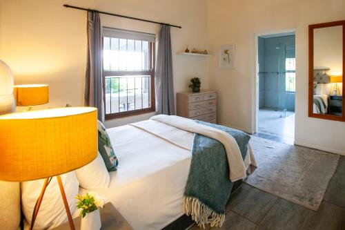 a bedroom with a large bed and a window at Leipzig Country House & Winery in Nuy