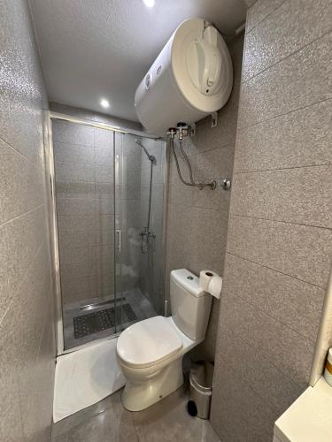 a small bathroom with a shower and a toilet at Guest House Dzakovic Stana in Žabljak