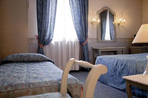 Hotel Bentivoglio Residenza D'Epoca 객실 침대