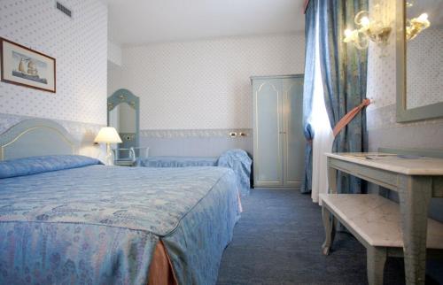 Ένα ή περισσότερα κρεβάτια σε δωμάτιο στο Hotel Bentivoglio Residenza D'Epoca