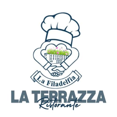 a chef with a basket of flowers in his hand at Hotel La Filadelfia in Lipari