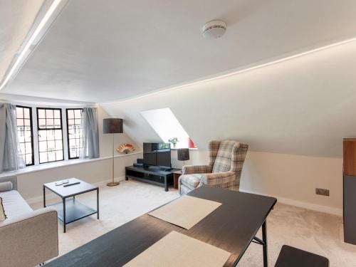 a living room with a couch and a table at Pass the Keys Newly renovated flat Sevenoaks High Street in Sevenoaks